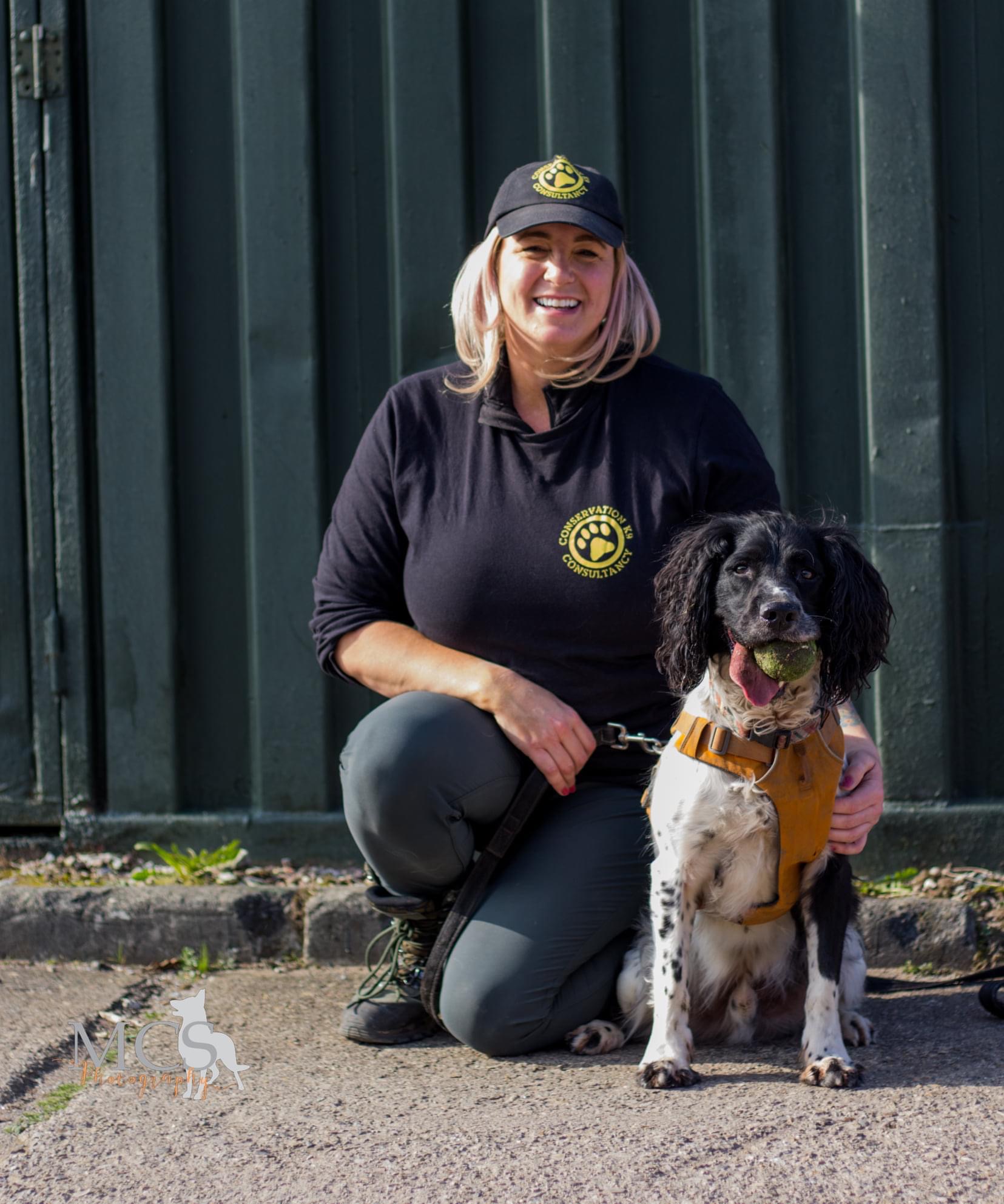 Louise in CK9C uniform, sitting next to her dog, Henry.